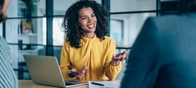 Shot of group of business persons in business meeting. Three entrepreneurs on meeting in board room. Creative business team on meeting in modern office. Female manager discussing new project with her colleagues. Company owner on a meeting with two of her employees in her office.